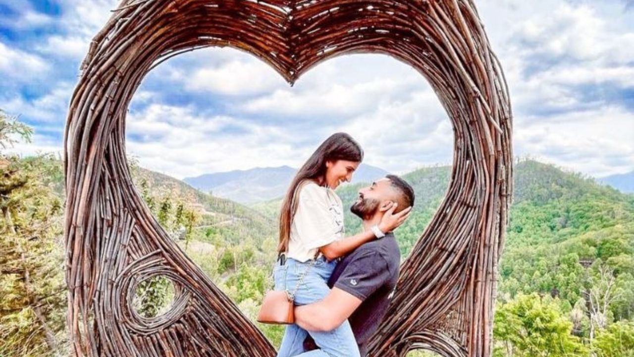 A romantic couple enjoying a scenic view of Gatlinburg.